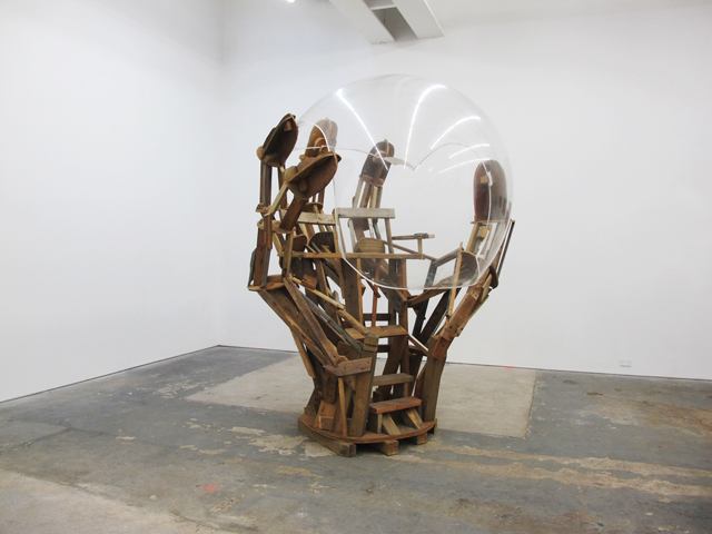 Untitled (Unfinished Hand Holding a Bell Bubble), 2013, reclaimed wood, hardware and helicopter bubble, 130 x 65 x 65 inches 